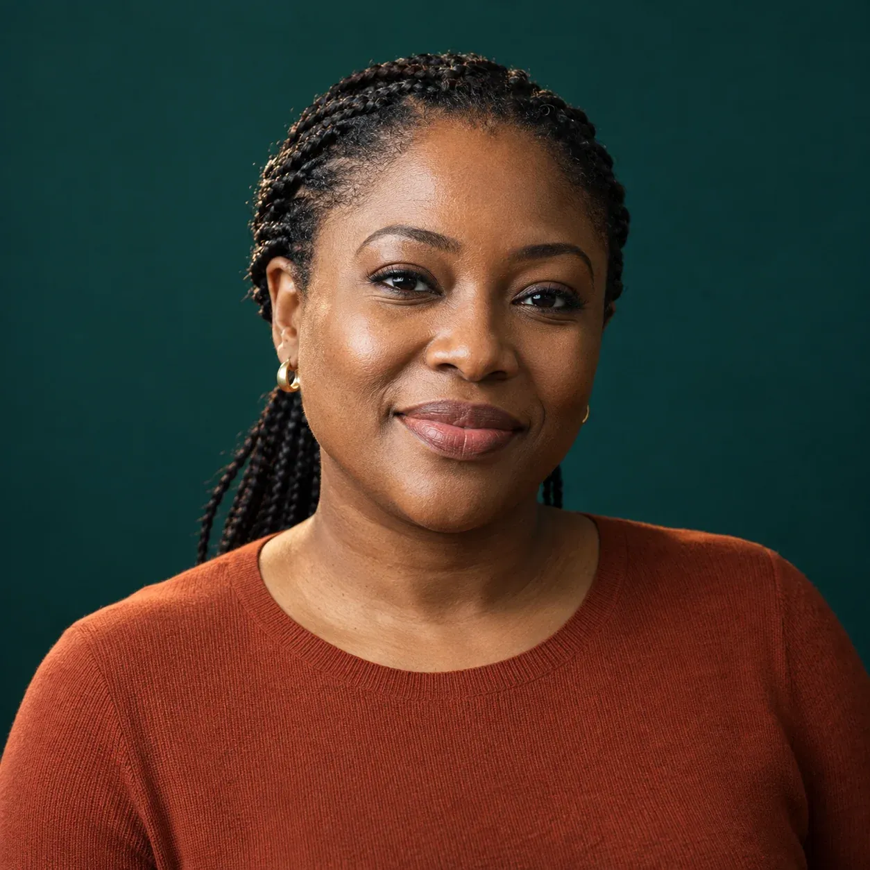 Portrait of Amara Okafor, Head of Trust & Safety at WhereTheFuture, against a deep teal backdrop.